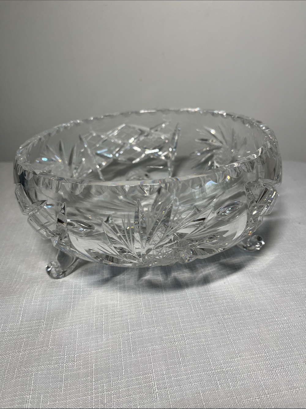 Vintage cut glass, footed crystal bowl featuring a pinwheel star pattern